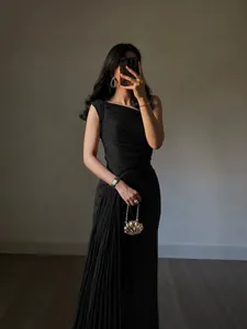 Elegant black one-shoulder pleated evening gown for women with a maxi skirt design