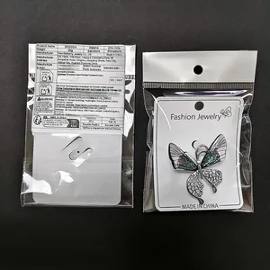 Emballage de vente détaillé d'une broche papillon en strass et alliage de zinc