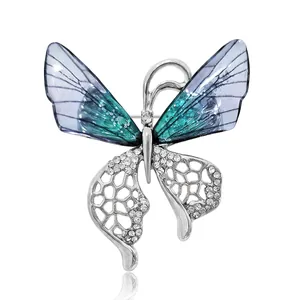 Broche papillon élégante avec ailes dégradées bleues et strass pour manteaux