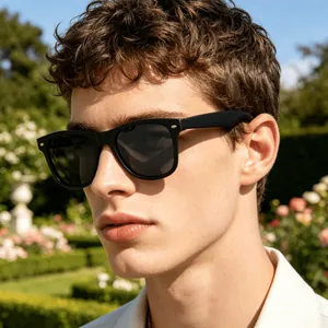 Macro detail of male model wearing black square polarized sunglasses in sunny garden