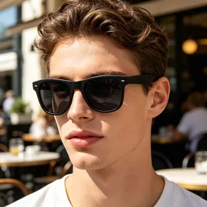 Close-up of stylish square polarised sunglasses with silver metal accents on a male model