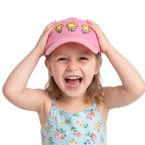 Close-up of pink baseball cap featuring detailed yellow flower embroidery on cotton fabric