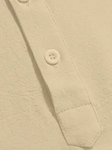 Detail of linen blend fabric texture with round resin buttons and neat stitching