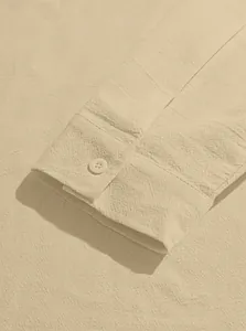Detailed close-up of linen blend shirt cuff with high-quality stitching and single button