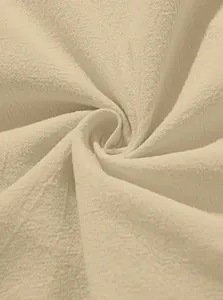 Close-up of beige linen blend fabric showing breathable twill weave texture