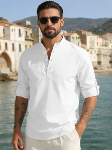 Detail of white linen blend shirt with stand collar and rolled-up sleeves in sun