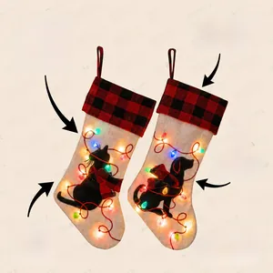 Detail of 18 inch LED lighted Christmas stockings with cat and dog buffalo plaid designs