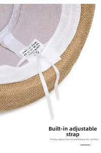 Detail view of straw jazz hat inner adjustable strap and 100% paper material label