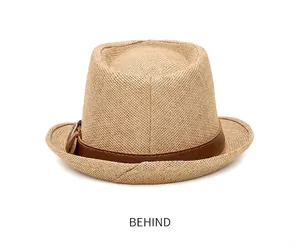 Rear view of woven straw jazz hat with brown leather band and metal buckle detail