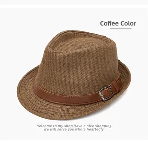 Detailed close-up of dark brown woven fedora hat featuring a leather band and silver buckle