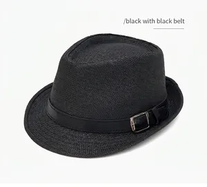 Detail of black woven jazz hat featuring a faux leather band and metal buckle accent
