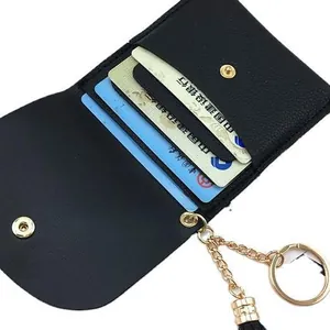Mini black pebbled faux leather coin purse with three card slots and gold keychain chain