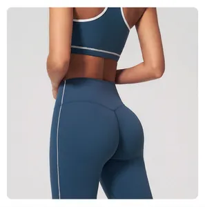 Detail view of high waist yoga pants showing back V-shaped lifting seam and contrast stitching