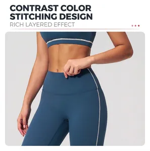 Detail of contrasting white stitching on high-waist navy yoga leggings for women