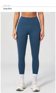 Detail of high waist dark blue yoga leggings showing elastic fabric and athletic fit