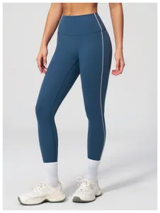 Detail view of high-waist yoga leggings with contrast side stripes and quick-dry fabric