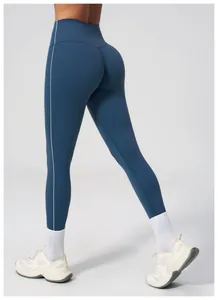 Detail of high-waisted navy yoga pants with white side stripes and body-shaping fit