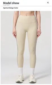 Model showing high-waisted beige yoga leggings with sporty black side stripes