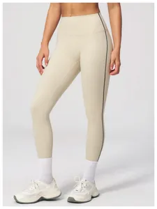 Detail view of high-waist brushed yoga leggings with slim black side stripe