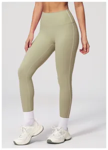 Detail of high waisted olive green yoga pants with brushed texture and slimming fit
