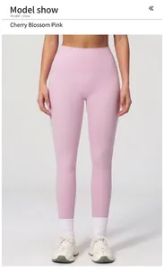 Detailed view of high waisted yoga pants in cherry blossom pink with seamless slim fit design