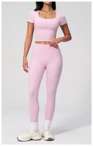 Detail of high-waist yoga pants with seamless texture and moisture-wicking fabric