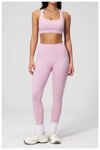 Pale pink high-waisted yoga set featuring athletic bra and leggings for fitness