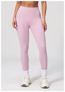 Detailed view of high-waisted yoga leggings in light pink with body-shaping fit