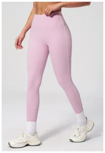 Close-up of light pink high waist yoga pants with white side stripe and high elasticity
