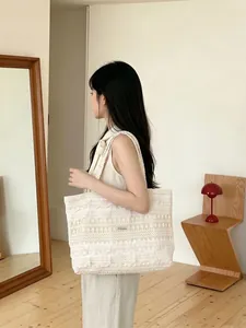 White lace hollow tote bag for summer beach vacation with elegant floral crochet pattern
