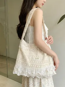 Beige floral lace tote bag with ruffled edges for summer vacations and beach use