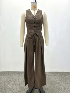 Detail of brown pinstripe vest and high-waisted trousers with smooth fabric texture