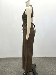 Detailed side view of brown pinstripe vest and trousers set with open back design