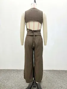 Detail view of brown pinstripe vest with open back design and adjustable buckle