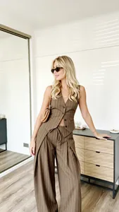 Detail of pinstripe brown vest set showing three-button design and premium fabric texture