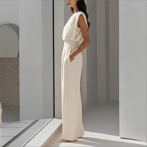 Detail shot of white sleeveless wide-leg jumpsuit with high waist and side pockets