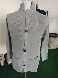 Close-up of men's grey waffle knit cardigan showing stand collar and large buttons