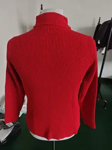 Detail view of red slim fit knitted cardigan showing textured back and stand collar