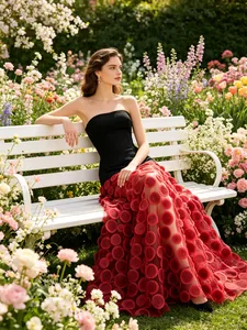 Elegant strapless contrast dress with red mesh polka dot skirt and slim black bodice