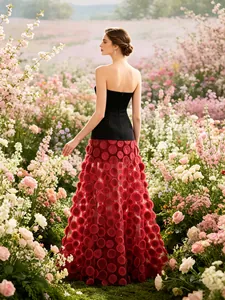 Elegant strapless evening gown with black slim bodice and red petal textured skirt