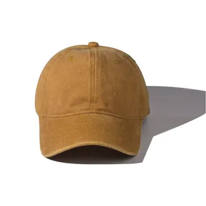 Close-up of the high-quality stitching and washed cotton fabric on the yellow baseball cap