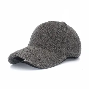 Detail view of dark grey lamb wool fabric and soft fuzzy texture on a baseball cap