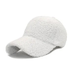 Close-up of fluffy white fleece baseball cap showing soft texture and premium stitching