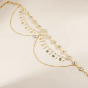 Macro view of gold multilayer body chain featuring sparkling crystals and sequins