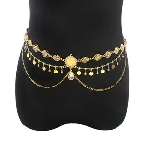 Detail of bohemian gold waist chain with crystal inlay and teardrop pendant decoration