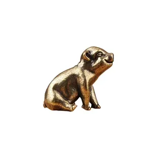 Macro shot of retro brass pig figurine showing vintage metal texture and details
