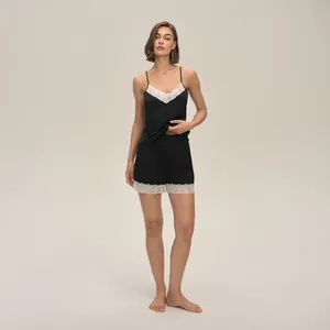 Women's black satin pajama set with camisole and lace trim shorts lounger