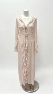 Detail of the soft ruffles and elegant V-neckline on this pale pink long sleeve maxi dress