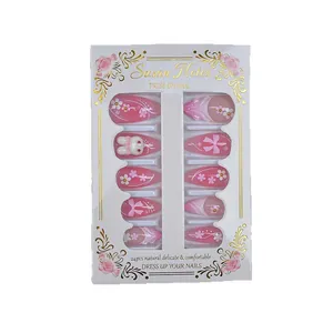 Sweet pink almond press-on nails with 3D bows, floral art and cartoon rabbit designs