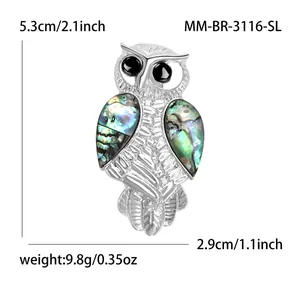 Vintage owl brooch with iridescent abalone shell wings and silver alloy finish
